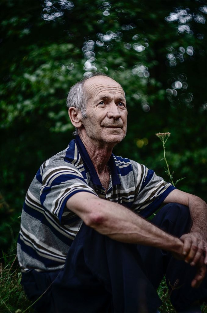old resident sitting in the garden