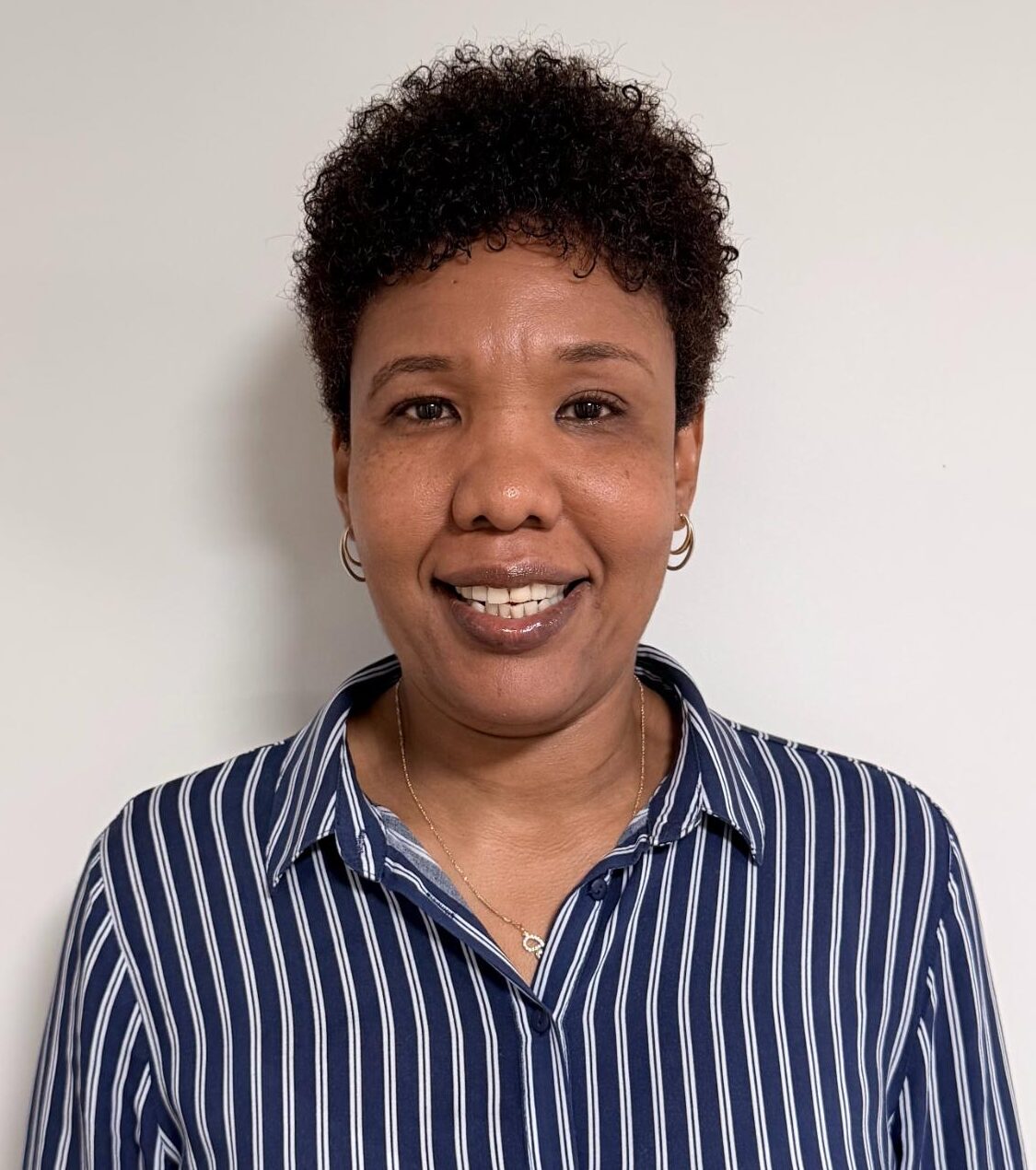 woman smiling in a striped shirt