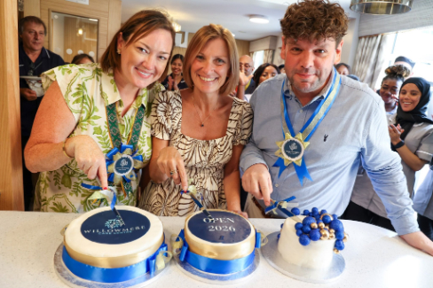 staff cutting cake